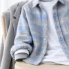 The flannel shirt, worn like a grown-up: the mid-layer that goes over a tee and under a jacket