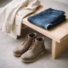 Workwear into late spring: chore coats, raw denim and the leather boots that bridge seasons